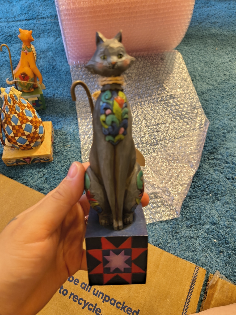Jim Shore Figurine Tag Showing Blue, White, Red, Gold Accents